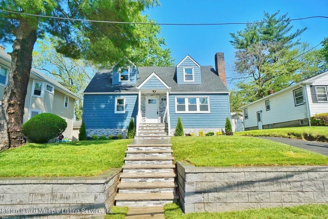 87 Woodward Avenue — renovated blue Cape Cod exterior