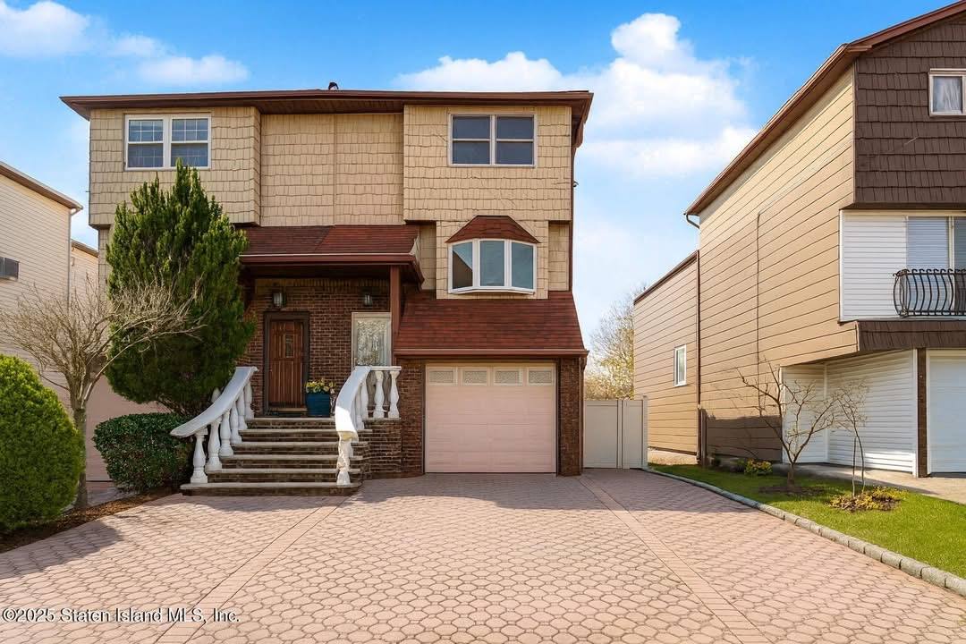 244 Slater Boulevard — renovated exterior with paver driveway