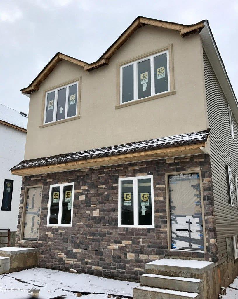 313 Moreland Street — new construction in progress, front elevation